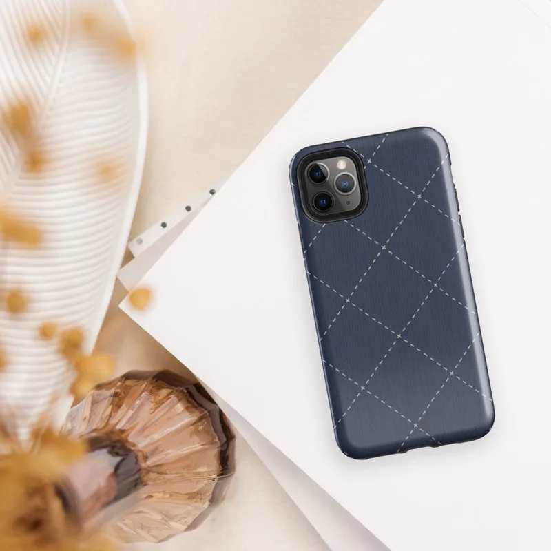 deep navy blue diagonal diamond grid with white dashed stitching lines and small cross-stitch marks at each intersection, resembling quilted fabric on Glossy Navy Quilted Diamond Stitch Tough Case for iPhone - default view
