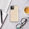 repeating diamond trellis of dashed lines and small cross stitches in soft grey on a warm blush cream background on Glossy Stitched Diamond Trellis Tough Case for iPhone - default view