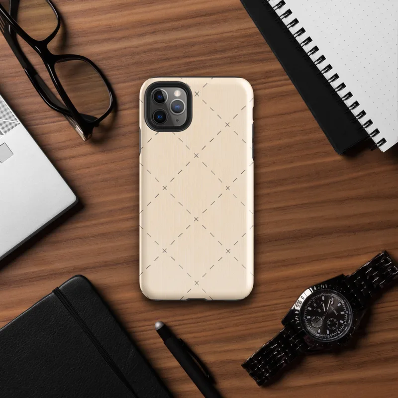 repeating diamond trellis of dashed lines and small cross stitches in soft grey on a warm blush cream background on Glossy Stitched Diamond Trellis Tough Case for iPhone - default view