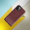 close-up chunky knit sweater texture in deep crimson red with subtle tonal variation and interlocking stitch rows on Glossy Crimson Knit Texture Tough Case for iPhone - default view
