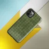 seamless close-up of olive green knitted fabric with repeating V-shaped stitch rows in varied shades of forest green on Glossy Forest Green Knit Texture Tough Case for iPhone - default view