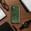 deep forest green grid of rounded cells with shadowed figure shapes emerging subtly from the repeating textile-like pattern on Glossy Shadow Grid Green Texture Tough Case for iPhone - default view