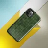 deep forest green grid of rounded cells with shadowed figure shapes emerging subtly from the repeating textile-like pattern on Glossy Shadow Grid Green Texture Tough Case for iPhone - default view