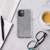 soft heathered gray surface with subtle organic texture variation resembling brushed stone or fine wool in muted silver tones on Glossy Storm Gray Minimalist Shield Tough Case for iPhone - default view