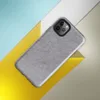 soft heathered gray surface with subtle organic texture variation resembling brushed stone or fine wool in muted silver tones on Glossy Storm Gray Minimalist Shield Tough Case for iPhone - default view