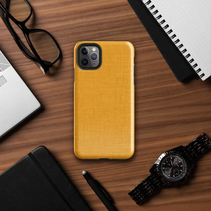 close-up woven linen fabric texture in warm golden amber and saffron tones with subtle thread detail on Glossy Golden Linen Texture Tough Case for iPhone - default view