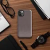 fine dark checkerboard weave pattern in deep charcoal and muted burgundy tones on a near-solid dark background on Glossy Dark Woven Texture Classic Tough Case for iPhone - default view