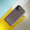 fine dark checkerboard weave pattern in deep charcoal and muted burgundy tones on a near-solid dark background on Glossy Dark Woven Texture Classic Tough Case for iPhone - default view