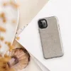seamless woven linen texture in warm beige with fine chevron pattern and scattered organic fiber flecks in muted tones on Glossy Raw Linen Texture Tough Case for iPhone - default view