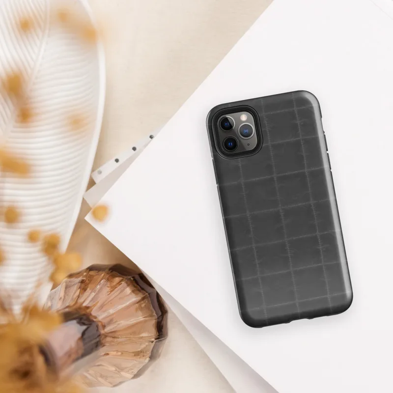 repeating dark charcoal quilted square grid pattern with faint stitched seams and subtle fabric-like texture on Glossy Dark Quilted Grid Tough Case for iPhone - default view