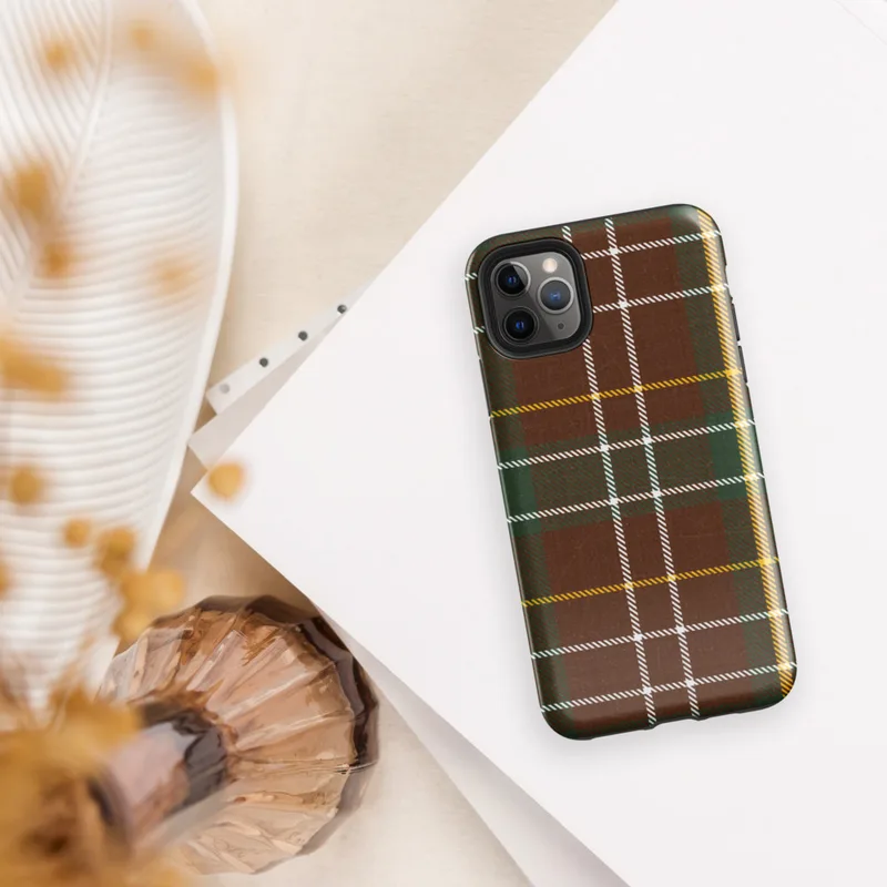 classic tartan plaid pattern in deep burgundy red and hunter green with intersecting white and golden yellow stripes on woven textile texture on Glossy Highland Plaid Tough Case for iPhone - default view