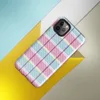 classic tartan plaid pattern in pastel sky blue, pale yellow, and bold magenta pink with fine diagonal hatching on a white background on Glossy Pastel Plaid Preppy Tough Case for iPhone - default view