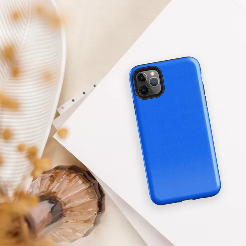 flat solid azure blue with subtle texture variations across the surface on Glossy Azure Blue Solid Tough Case for iPhone - default view
