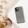 micro-checkerboard pattern in slate gray and warm sand with subtle colorful flecks and fine thread-like lines suggesting woven fabric on Glossy Steel Grid Woven Texture Tough Case for iPhone - default view