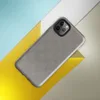 micro-checkerboard pattern in slate gray and warm sand with subtle colorful flecks and fine thread-like lines suggesting woven fabric on Glossy Steel Grid Woven Texture Tough Case for iPhone - default view