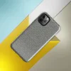 close-up checkerboard weave pattern with teal and natural linen tones mimicking woven tatami or basket textile on Glossy Woven Slate Grid Tough Case for iPhone - default view