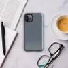close-up diagonal twill weave of faded blue denim fabric with subtle tonal variation and natural thread texture on Glossy Classic Denim Weave Tough Case for iPhone - default view