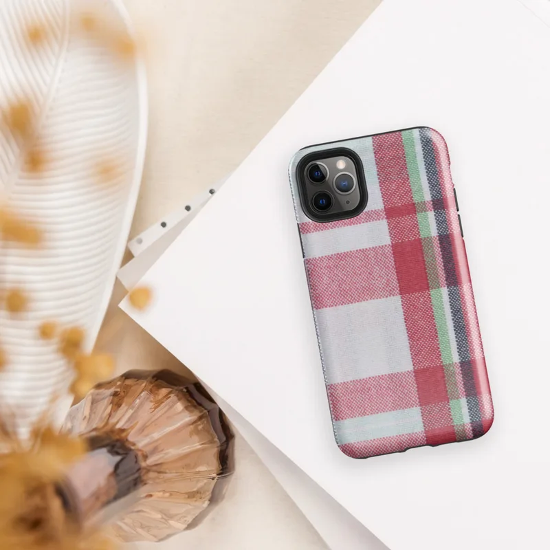 traditional tartan plaid pattern with bold red, navy, forest green, and white intersecting woven stripes on Glossy Classic Plaid Heritage Tough Case for iPhone - default view