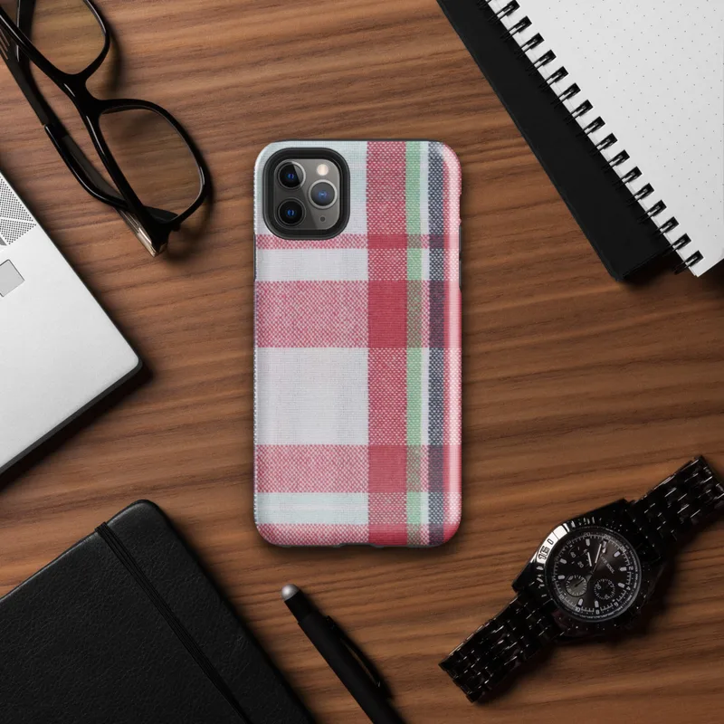 traditional tartan plaid pattern with bold red, navy, forest green, and white intersecting woven stripes on Glossy Classic Plaid Heritage Tough Case for iPhone - default view