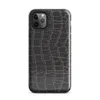 close-up black crocodile scale skin texture with raised interlocking rectangular scales and deep charcoal tones on Glossy Midnight Crocodile Armor Tough Case for iPhone - default view