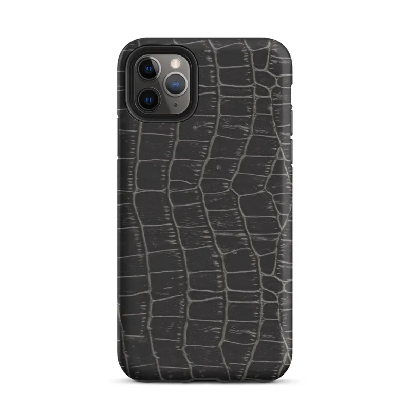 close-up black crocodile scale skin texture with raised interlocking rectangular scales and deep charcoal tones on Matte Midnight Crocodile Armor Tough Case for iPhone - default view