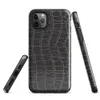 close-up black crocodile scale skin texture with raised interlocking rectangular scales and deep charcoal tones on Glossy Midnight Crocodile Armor Tough Case for iPhone - default view