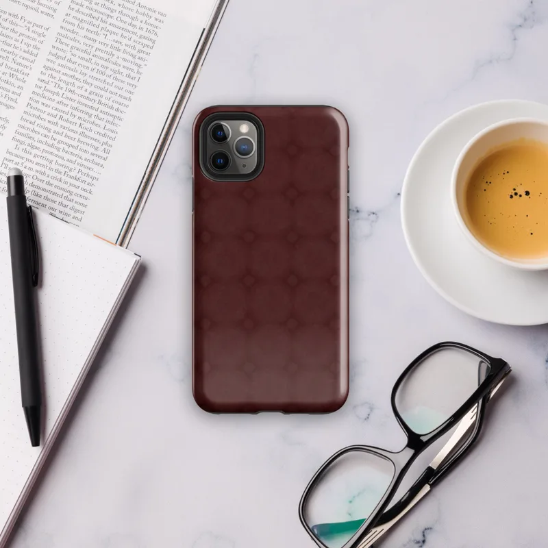 tone-on-tone deep crimson repeating lattice of interlocking circles and diamond accents with a soft textured burgundy background on Glossy Crimson Lattice Elegance Tough Case for iPhone - default view