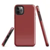 flat solid deep crimson red with no pattern or imagery, rich muted scarlet tone filling the entire surface on Glossy Crimson Red Solid Bold Tough Case for iPhone - default view