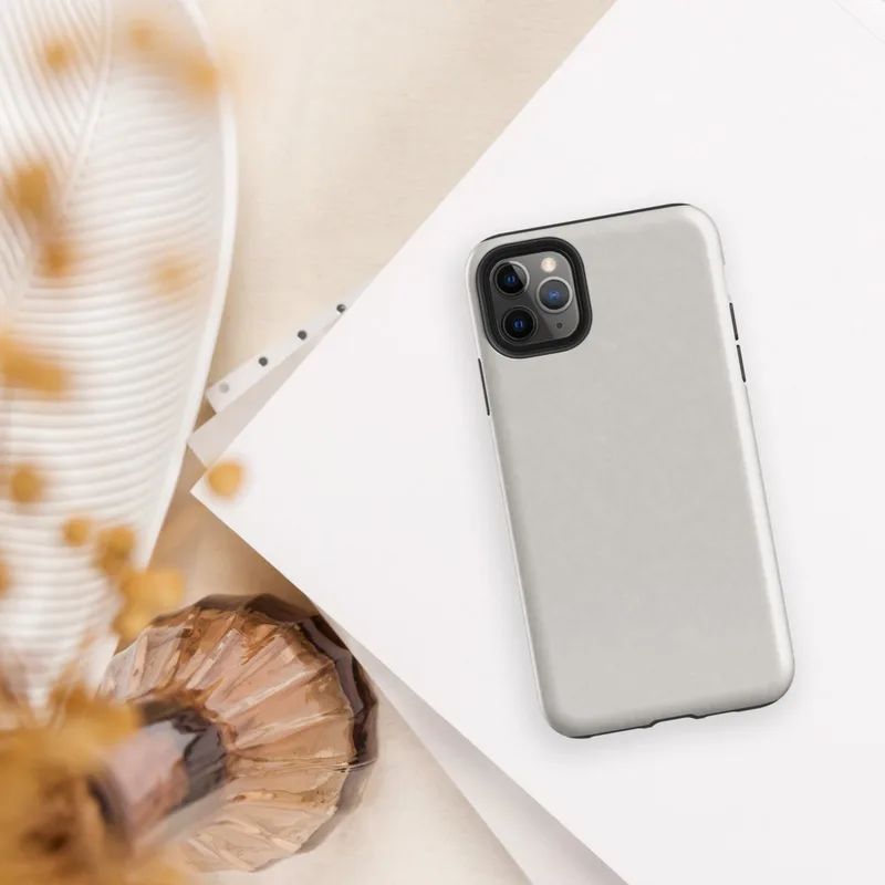 solid warm gray surface with subtle tonal texture variation across a smooth matte finish on Glossy Classic Warm Gray Minimal Tough Case for iPhone - default view