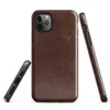 distressed dark mahogany leather texture with amber and tan crackle veining in an aged vintage patina style on Glossy Worn Leather Heritage Tough Case for iPhone - default view