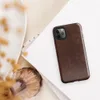 distressed dark mahogany leather texture with amber and tan crackle veining in an aged vintage patina style on Glossy Worn Leather Heritage Tough Case for iPhone - default view