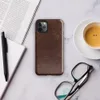 distressed dark mahogany leather texture with amber and tan crackle veining in an aged vintage patina style on Glossy Worn Leather Heritage Tough Case for iPhone - default view