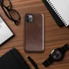 distressed dark mahogany leather texture with amber and tan crackle veining in an aged vintage patina style on Glossy Worn Leather Heritage Tough Case for iPhone - default view