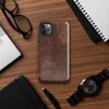 distressed burgundy and tan leather surface with crackled, aged patina and irregular worn markings on Glossy Worn Leather Vintage Tough Case for iPhone - default view