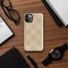 diagonal plaid grid of double dark brown lines forming diamond shapes on a warm beige and tan textured background on Glossy Classic Diagonal Plaid Tough Case for iPhone - default view