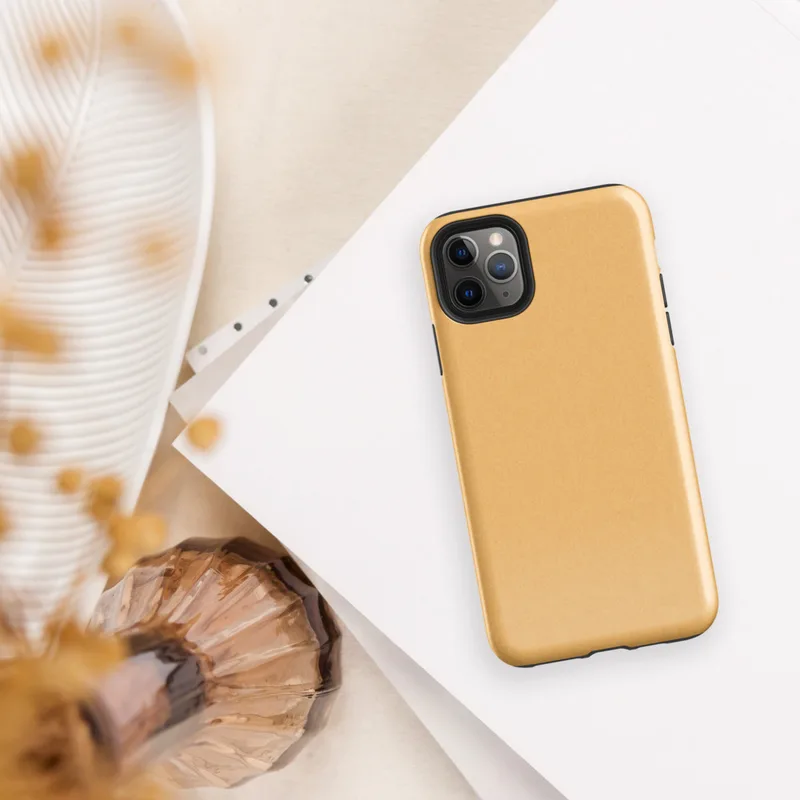 flat solid warm golden apricot color with a smooth matte paper-like texture and subtle natural fiber grain on Glossy Golden Hour Minimal Tough Case for iPhone - default view