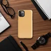 flat solid warm golden apricot color with a smooth matte paper-like texture and subtle natural fiber grain on Glossy Golden Hour Minimal Tough Case for iPhone - default view