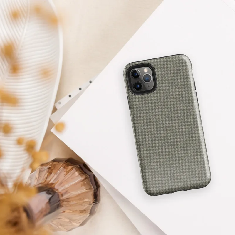 close-up woven textile pattern in warm grey and cream tones resembling fine suiting or linen fabric on Glossy Woven Texture Slate Tough Case for iPhone - default view
