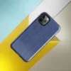 close-up realistic blue denim fabric texture with visible diagonal twill weave and subtle thread variation on Glossy Classic Blue Denim Texture Tough Case for iPhone - default view