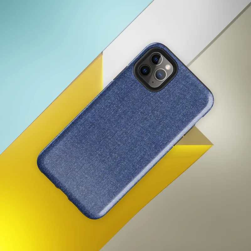 close-up realistic blue denim fabric texture with visible diagonal twill weave and subtle thread variation on Glossy Classic Blue Denim Texture Tough Case for iPhone - default view