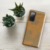 torn and peeling kraft paper revealing corrugated cardboard fluting beneath, warm amber and taupe tones with ragged irregular edges on Glossy Worn Cardboard World Tough Case for Samsung - default - Front view