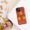 Glossy Sunshine Bloom MagSafe Tough Case for iPhone — repeating pattern of yellow multi-petal sunflowers with blue centers