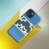 Glossy Arctic Fracture Bold MagSafe Tough Case for iPhone — jagged cracked ice pattern in deep teal and cream