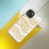 Glossy Golden Tides Waves MagSafe Tough Case for iPhone — flowing golden wave lines with ornate spiral crests in warm amber
