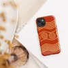 Glossy Ancient Waves Gold Spiral MagSafe Tough Case for iPhone — repeating golden spiral circles and wavy parallel lines