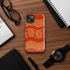 Glossy Ancient Waves Gold Spiral MagSafe Tough Case for iPhone — repeating golden spiral circles and wavy parallel lines