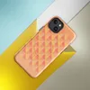 Glossy Sunset Grid Geometric MagSafe Tough Case for iPhone — repeating triangle grid mosaic in warm coral, peach, blush