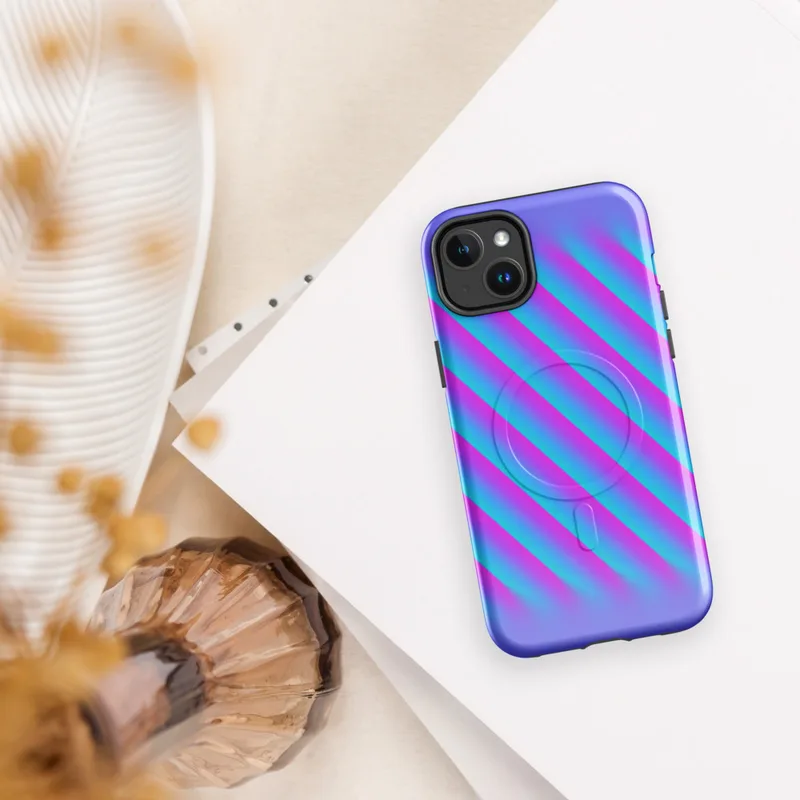 Glossy Neon Diagonal Surge MagSafe Tough Case for iPhone — diagonal soft-edged stripes in vivid cyan and hot magenta fading