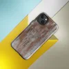 Glossy Rusted Iron Fortress MagSafe Tough Case for iPhone — heavily weathered metal panels with streaking rust in burnt