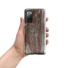Glossy Industrial Rust Storm Tough Case for Samsung — weathered concrete panels with streaks of rust, burnt sienna